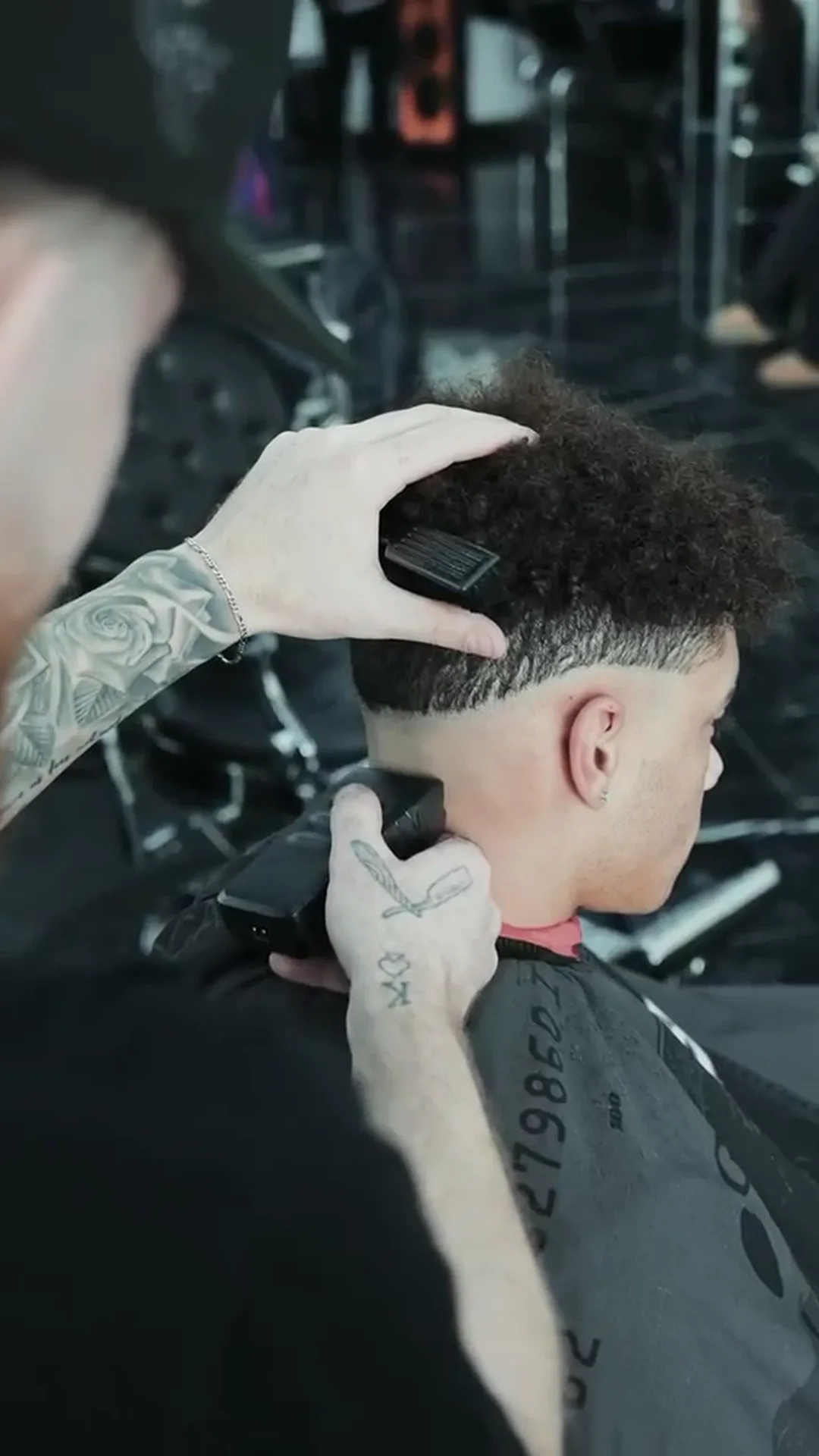 A fade being taken down on curly hair